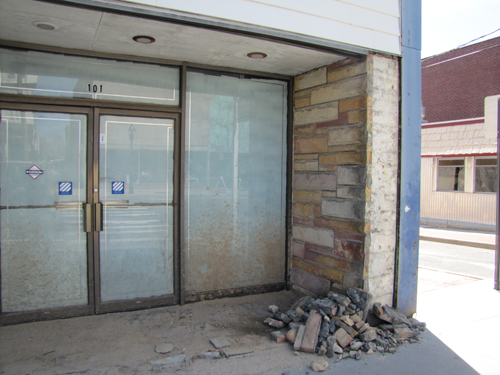 The glazed over window of the long-vacant West Marine building in downtown, not to mention the bricks falling apart, are things town officials hope to see less of