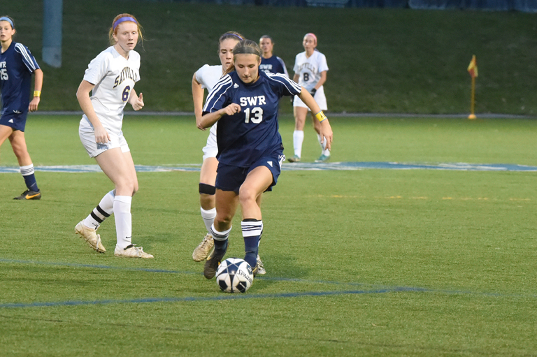 Shoreham-Wading River sophomore Alex Kuhnle one her way toward scoring the only goal in Wednesday's Class A county championship game. (Credit: Robert O'Rourk)