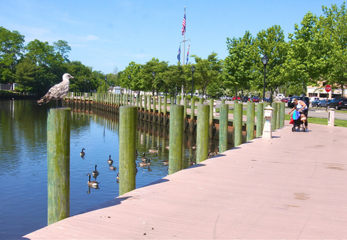 BARBARAELLEN KOCH FILE PHOTO | The Peconic River boardwalk that runs along the East Main Street parking lot.