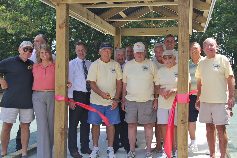 Town board members joined the Windcrest East Bocce Team for a ribbon cutting ceremony Tuesday morning.
