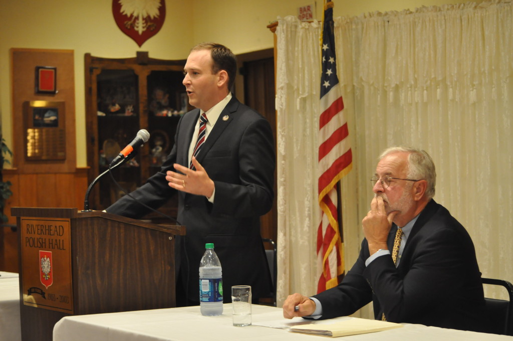 State Senator Lee Zeldin (left) and Congressman Tim Bishop (right) took turns a podium in Polish Hall to address questions Wednesday night in Riverhead.