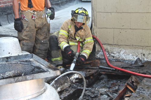 STEVE ROSSIN PHOTO | Riverhead firefighters put out a fire on the roof of Cliff's Rezdezvous in Riverhead.