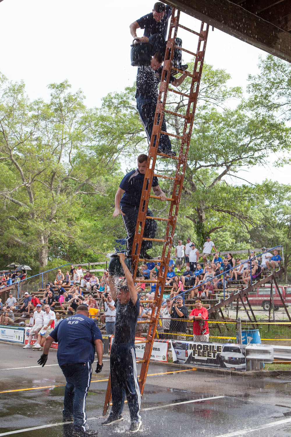 Riverhead Ironmen in bucket brigade competition.