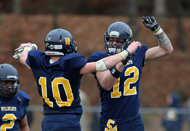 Shoreham-Wading River seniors Christian Clarkin (10) and Daniel Hughes celebrate during their victory over Port Jefferson. (Credit: Daniel De Mato)