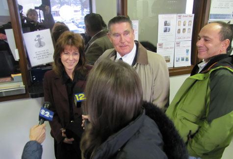  | A smiling Linda Kabot fields questions from reporters alongside her lawyer.