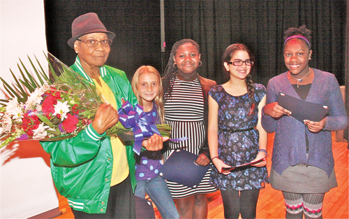 BARBARAELLEN KOCH PHOTO Medal of Honor recipient Pfc. Garfield M. Langhorn's mother Mary Langhorn with this year's essay contest winners Pulaski Street sixth graders (from left) Christine Thomas, Laniece Hutley, Nina Geraci and honorable mentio Summer Scott.