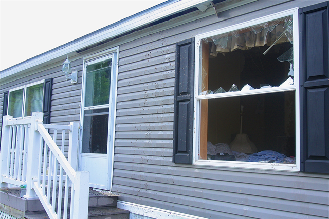 The mobile home a few hours following Sunday's fire. (Credit: Barbaraellen Koch)