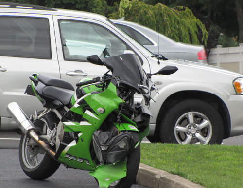 TIM GANNON PHOTO | The motorcycle and minivan after Saturday's crash.