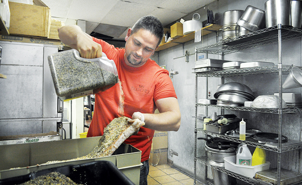 RACHEL YOUNG FILE PHOTO | Patrick Gaeta curing bacon earlier this year.
