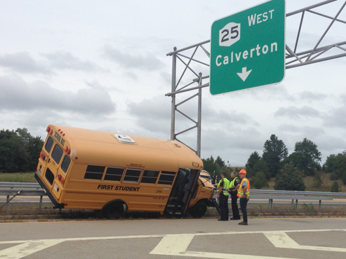 A school bus got stuck on the guard rail of the L.I.E. Tuesday afternoon. (Credit: Paul Squire)