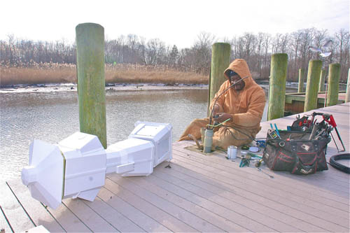 Downtown Riverhead marina stations fixed after Sandy BARBARAELLEN KOCH PHOTO | Foreman Sam Parris of Hinck Electrical Contracting of Bohemia at work on the town's riverfront dock Friday.