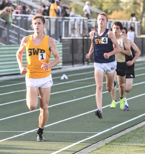 Shoreham-Wading River seniors Ryan Udvadia and Keith Steinbrecher race in the 3,200 of the Division III Championship. (Credit: Robert O'Rourk)