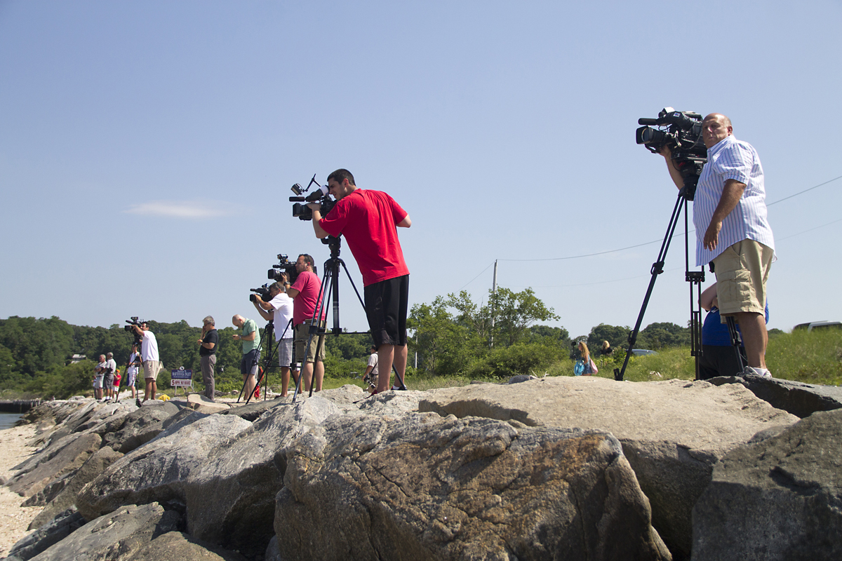 More than a dozen media outlets swarmed the Mattituck shore after the crash. (Credit: Paul Squire)