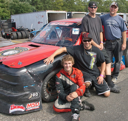 GARRET MEADE PHOTO | From left, three generations of family race car drivers: Mark Stewart. Roger Turbush, Chris Turbush and Dan Turbush.