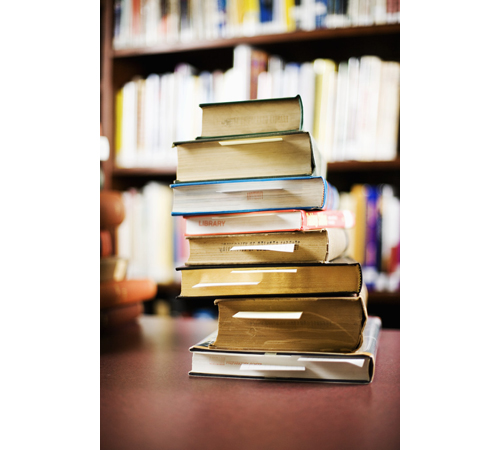 Books can tend to pile up over time. (Credit: Corbis Images)