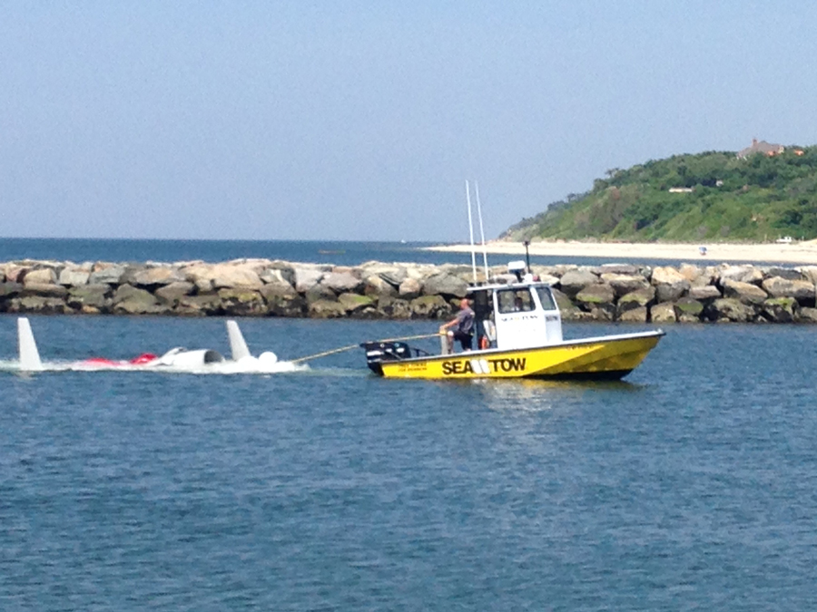The plane that crashed in the Sound Monday morning is towed to shore about 3:15 p.m. (Credit: Paul Squire)